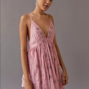 Embroidered, beaded, sequin plunging, backless mini dress.